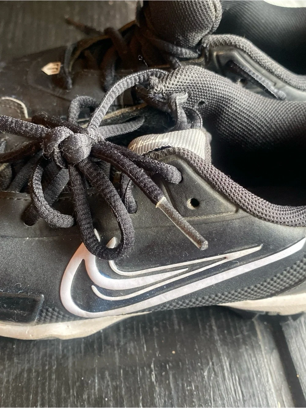 Nike Kids Black Sneakers with White Swoosh football soccer baseball cleats